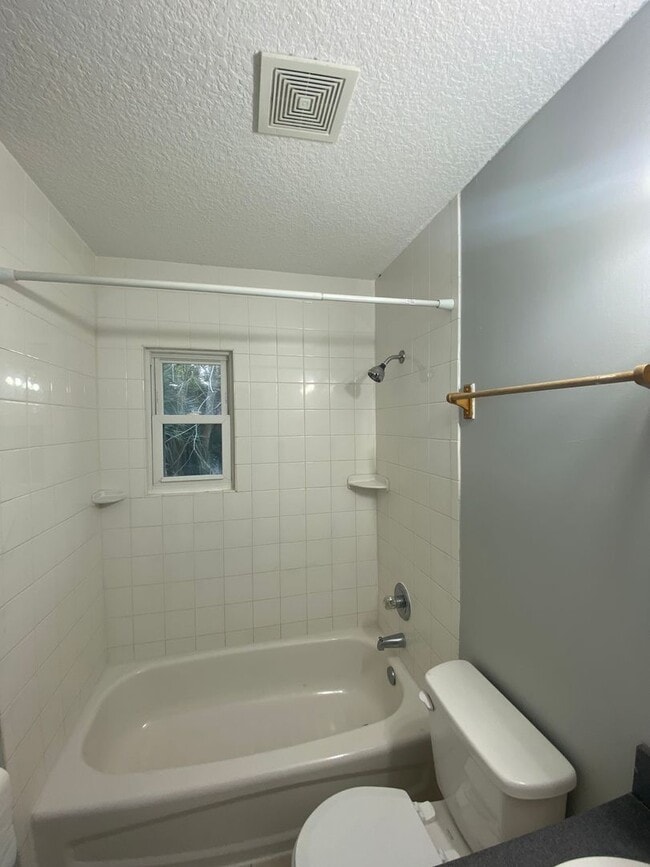 Building Photo - Beautiful 2/1B all tiled 2nd floor condo i...
