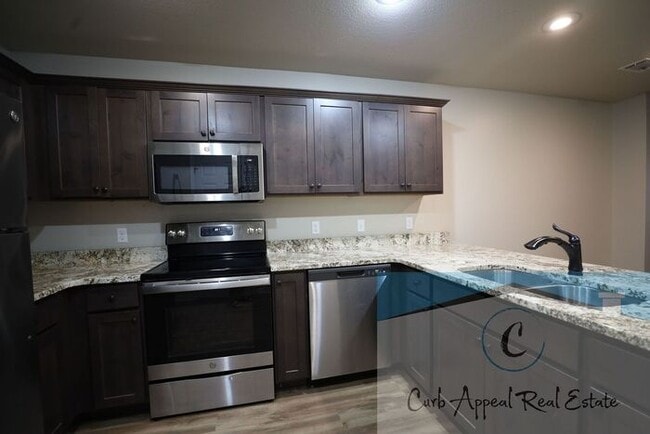 Building Photo - Move in special $800!! Luxury 2 bed, 1 bath duplex - recent construction!! Washer, dryer and inte...