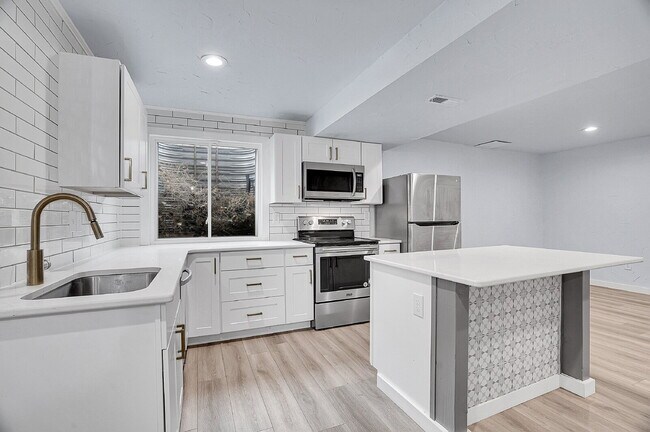 Building Photo - $3,295.95 - 3 bed, 2 bath updated Home in Littleton with Two Full Kitchens and Impressive Yard!