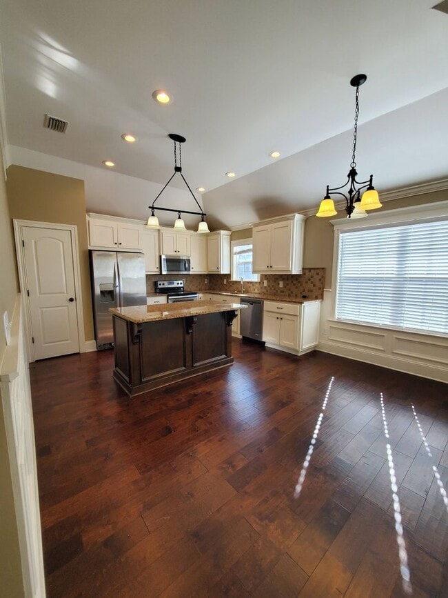 Building Photo - Spacious 4-Bedroom Home with Open Layout, Granite Finishes & Fenced Yard