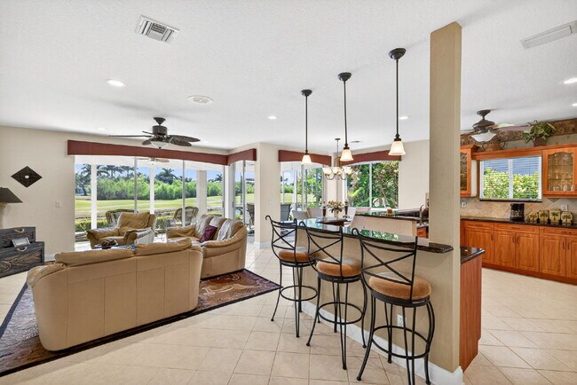 Building Photo - This 2 bedroom plus den, 2 bath condo with a one car garage offers expansive golf course and lake...