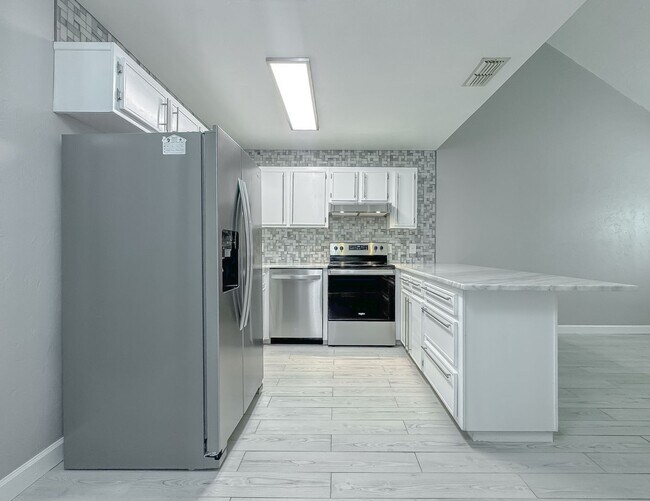 Building Photo - MODERN! Walk to FSU 2/2 w/ Marble Counters, Stainless Steel Appliances, & Privacy Fenced Yard! Av...