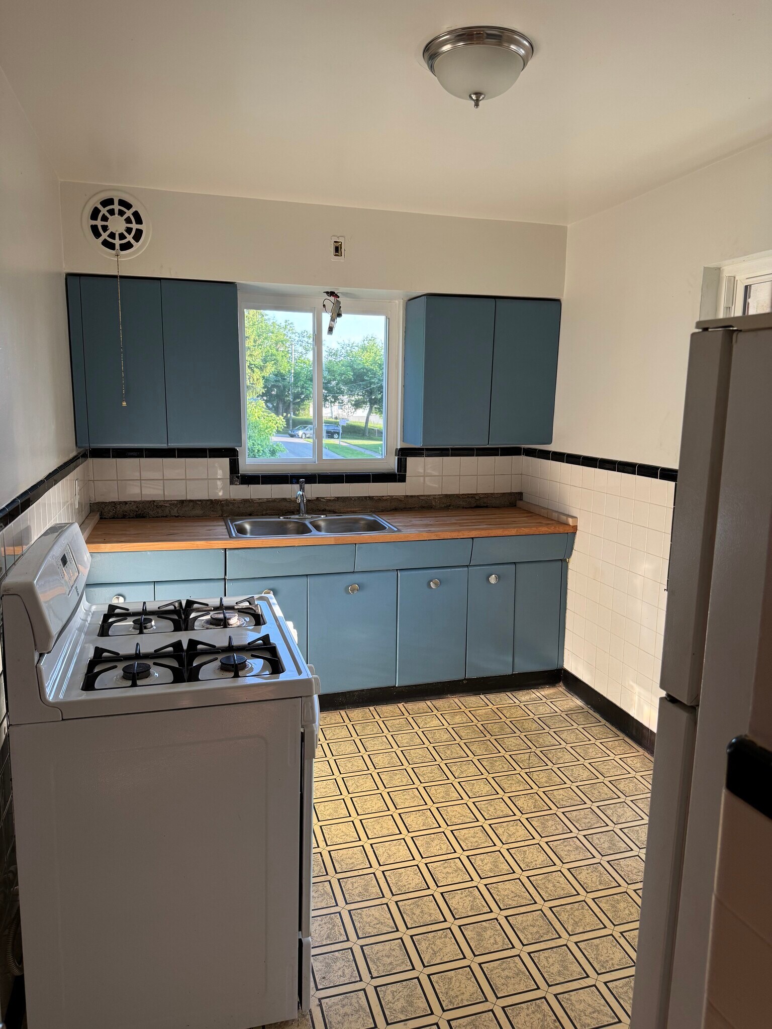 Kitchen (Flooring and backsplash will be installed prior to move in) - 3903 Kirkup Ave