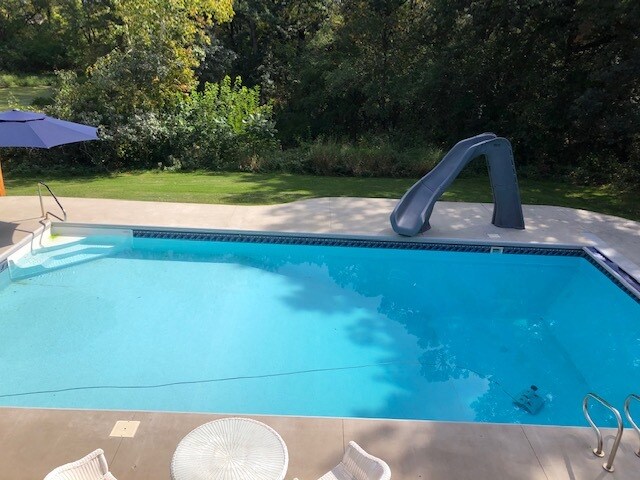 Large backyard pool and bar entertainment area - 9731 110th St N