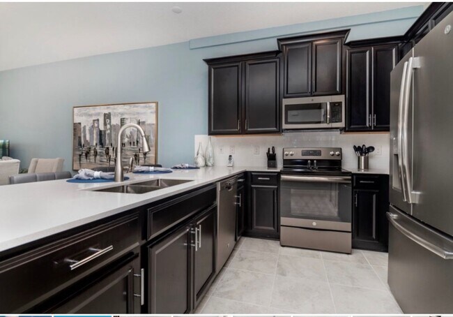 Building Photo - BEAUTIFUL CHAMPIONS GATE 2 BED 2 BATH COND0  w/GARAGE - FULLY FURNISHED - 12 MONTH RENTAL