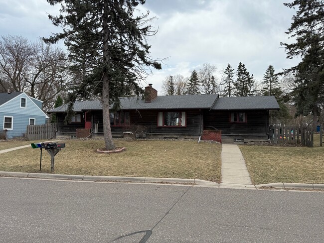 Separate entrances on front of house. 1120 is unit on the left - 1120 Lealand Rd E
