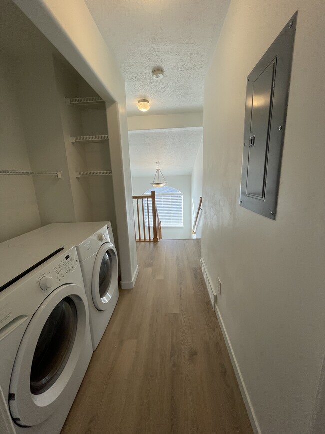 Upstairs hallway with washer/dryer off master bedroom - 9485 S Fairway View Dr