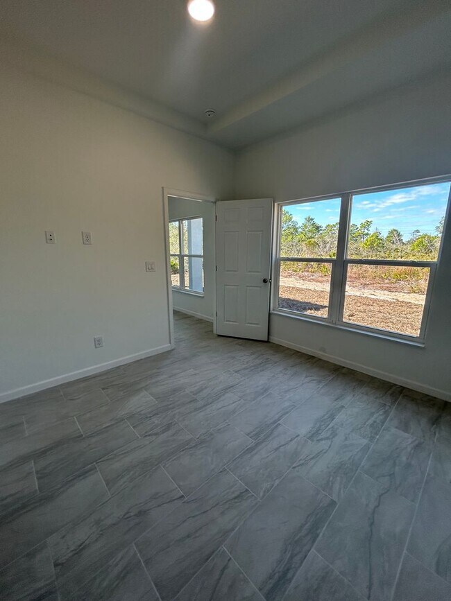 Building Photo - JUST BUILT! Spacious 4/2/2 Home -Perfect for Your Family in SW Lehigh Acres
