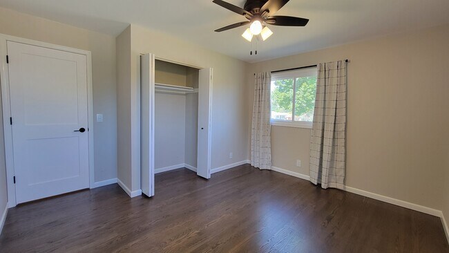 Bedroom 3. Refinished hardwood floors, 4 ft wide closet, new windows and ceiling fan. - 6305 49th Ave