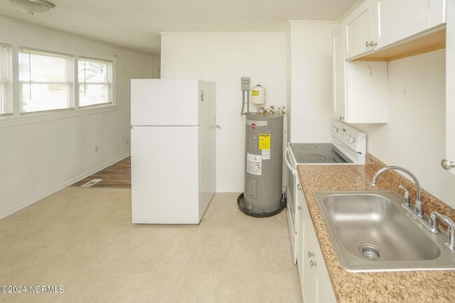 Building Photo - Lawn Care Included in Jville City Limits!