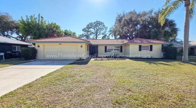 Building Photo - SPACIOUS SARASOTA HOME WITH LARGE FENCED YARD! MOVE IN READY! ALL TILE/ NEW LVP!