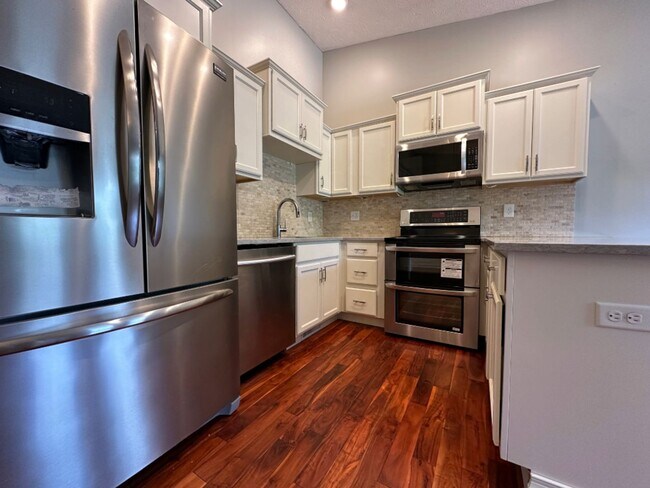 Building Photo - Sophisticated Townhome Living with Modern ...