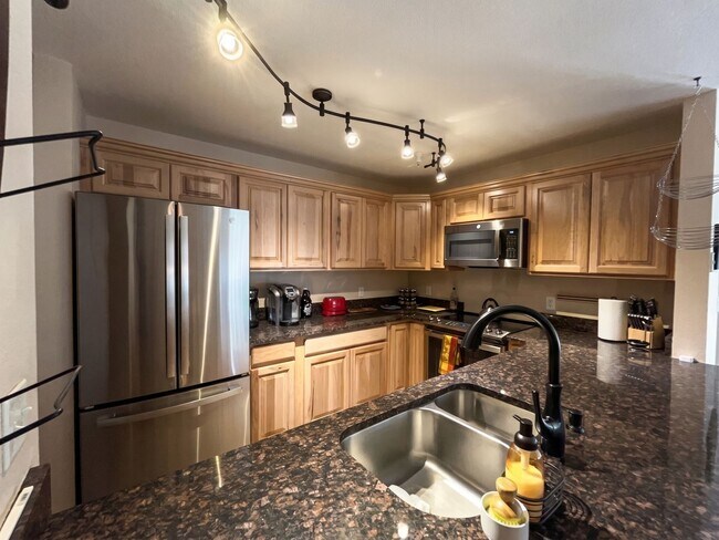Building Photo - Two-Bedroom Condo with Attached Garage, Available Now