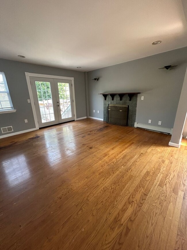 Building Photo - Discover Your Dream Home in Neptune: Spacious 4-Bedroom, 2.5-Bath with Private Backyard and Drive...