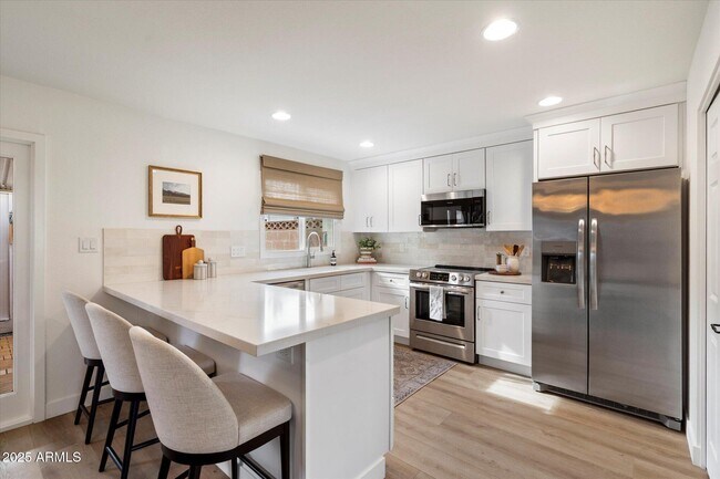 Building Photo - 8447 E Montebello Ave