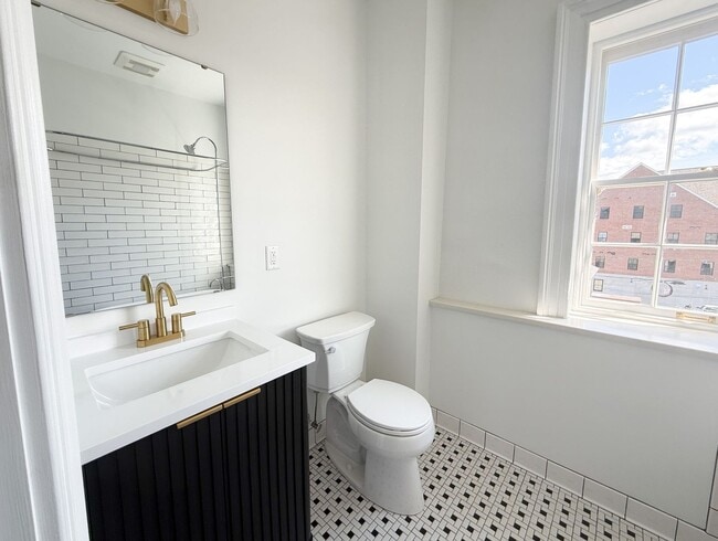 Building Photo - Renovated One-Bedroom Gem Steps from Train...