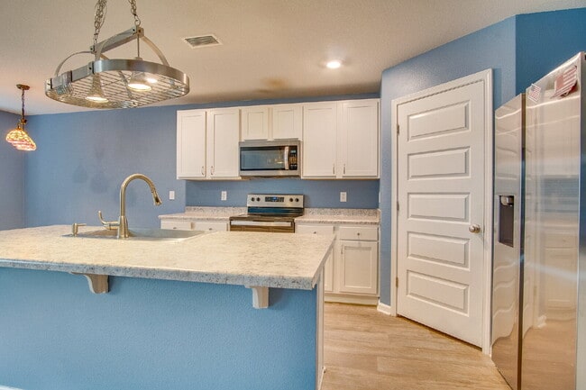 Building Photo - Season’s Savings! Spacious 5BR Near NAS – ...