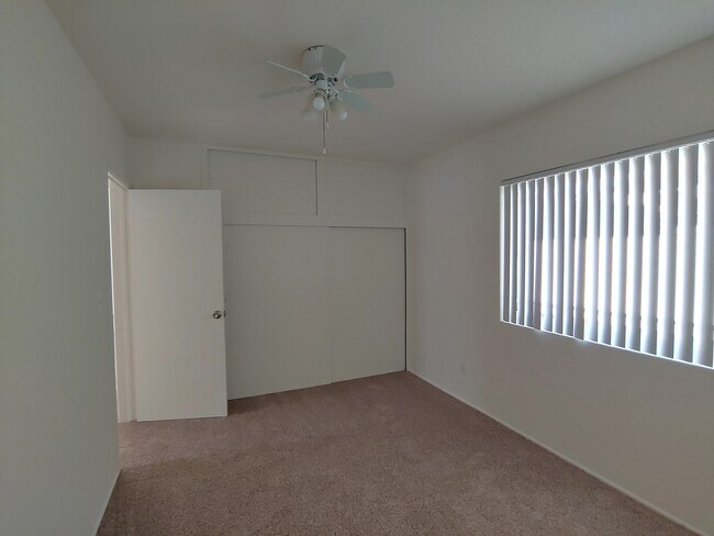 Front Bedroom with closets and upper cupboard storage (door to hallway) - 147 S Myrtle Ave