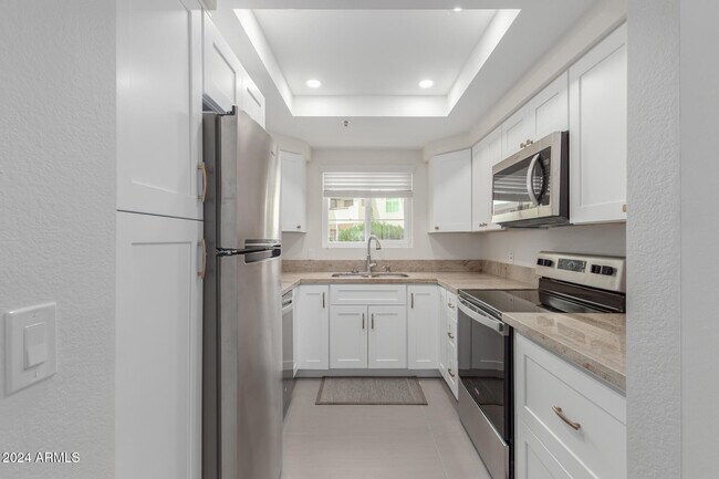 Building Photo - 9450 E Becker Ln