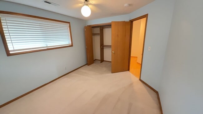 Building Photo - 4bd/3ba HUGE Home w/Hardwood Floors, Russian Fireplace, 2-Car Garage & Fenced Back Yard!