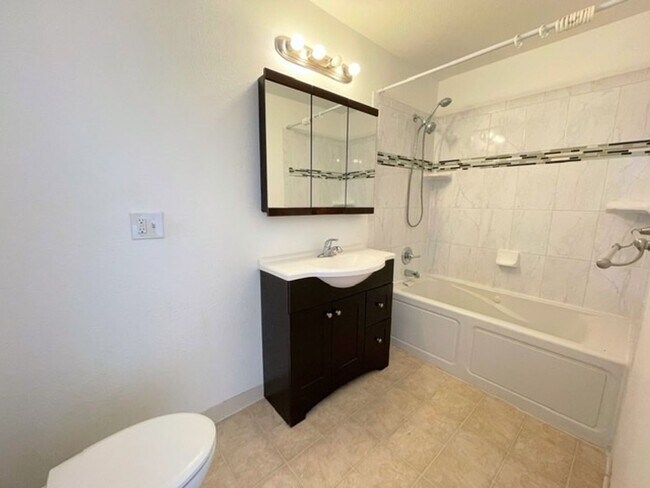 Building Photo - RARE FIND! Spacious and bright three bedroom apartment in South Anchorage with in unit laundry, f...