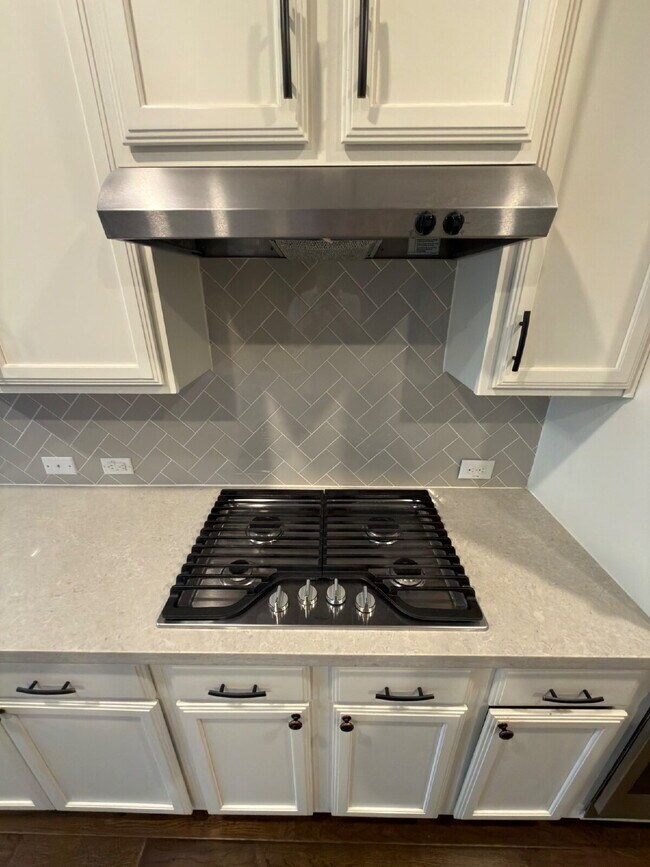 Building Photo - Four bed two bath on a corner lot with a pool in Sunfield. Gas cook top, double ovens. Open kitch...