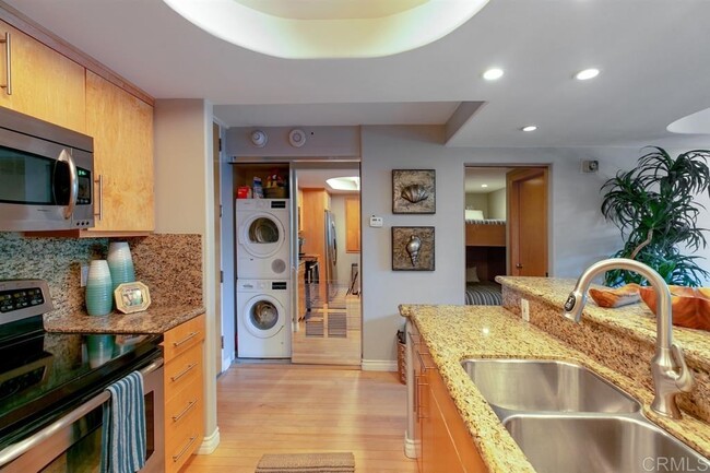 Kitchen view and washer and dryer - 1830 Avenida Del Mundo