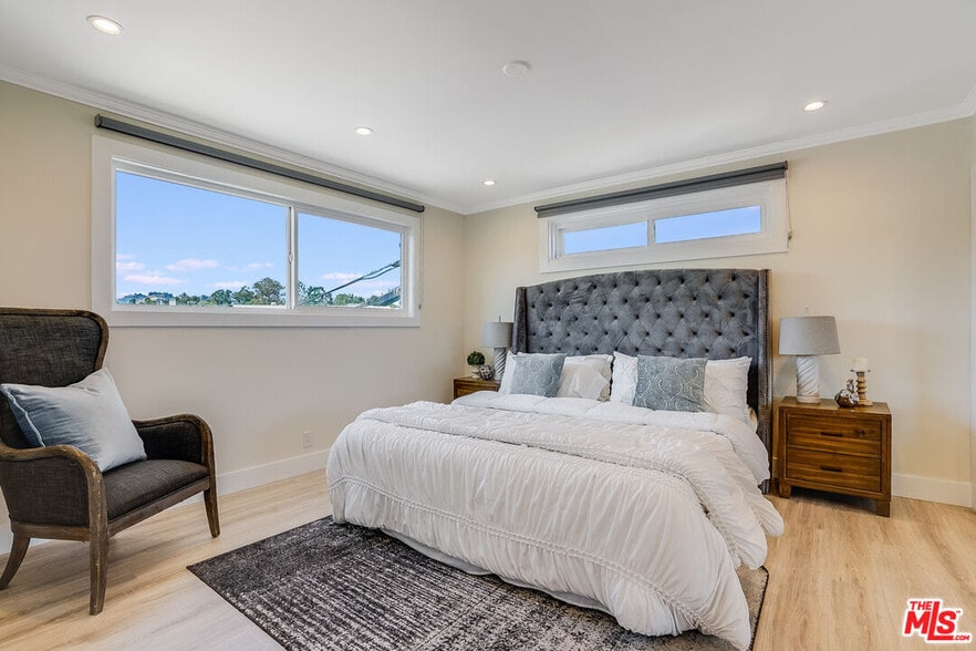 master bedroom with large windows - 11670 W Sunset Blvd