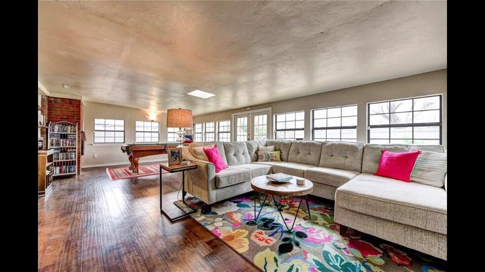 Living room with door out to backyard. - 2056 NW 48th St