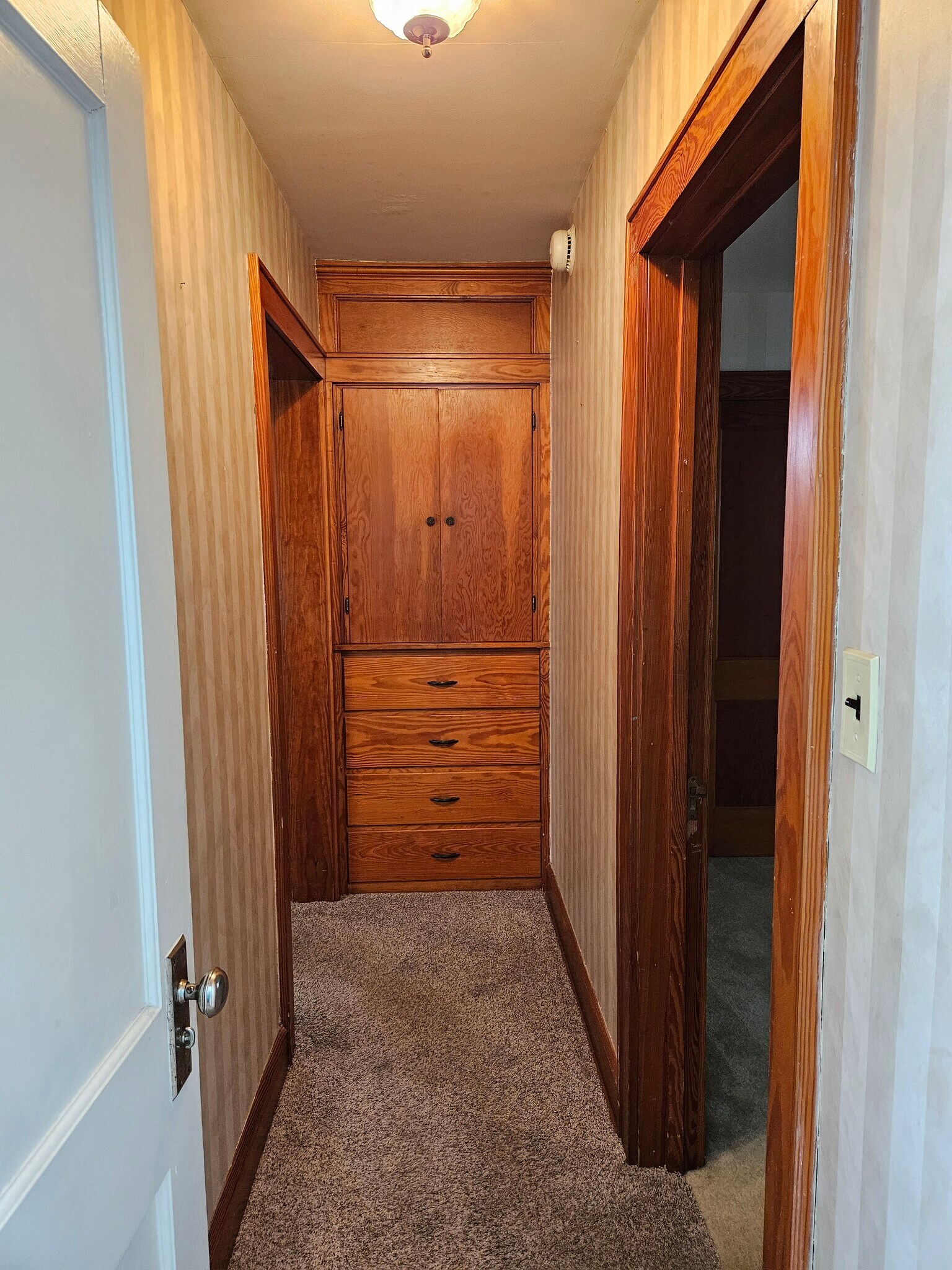 Hallway with built in cabinet and drawers - 4047 Mogadore Rd