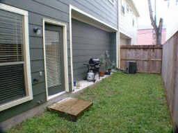 Back patio. Currently covered with gravel (no grass) - 855 W 25th St