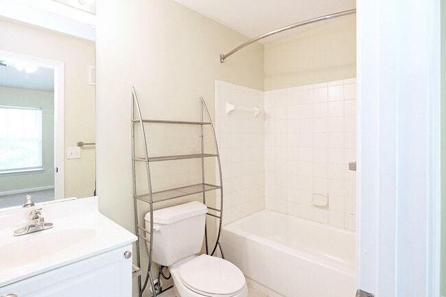 Building Photo - Move-In Ready! Pet-Friendly Woodlands Condo with Community Amenities