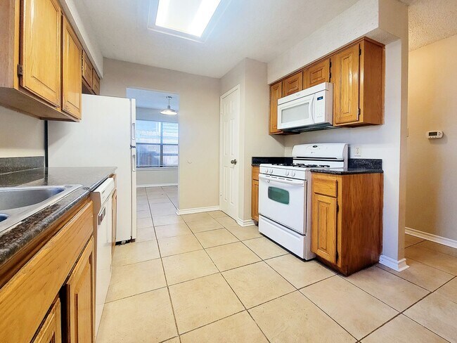 Building Photo - Warm & Inviting 4BR / 2.5BA Home with Covered Deck and 2-Car Garage