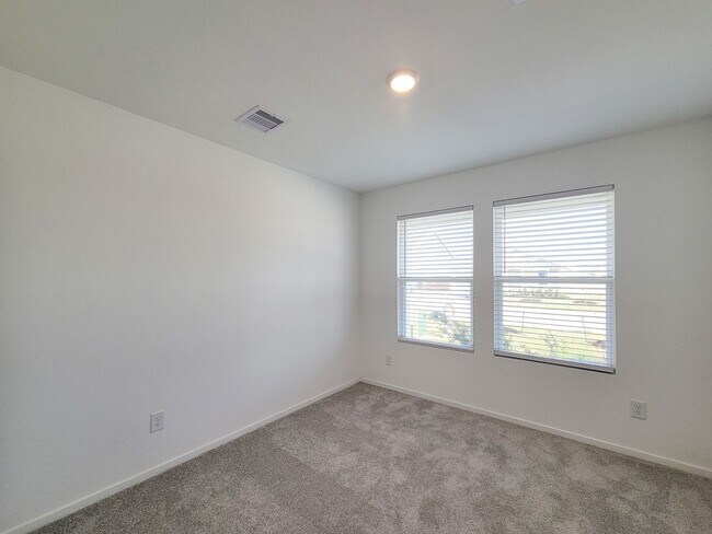 Building Photo - This single-level home showcases a spacious open floorplan shared between the kitchen, dining are...