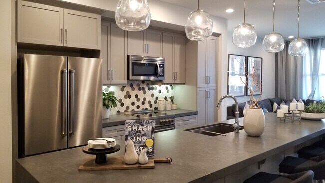 Building Photo - Stunning Fully Furnished Tri-Level Townhome 4BD/4BATHS! Central AC/Heat with Solar! 2 Car attache...