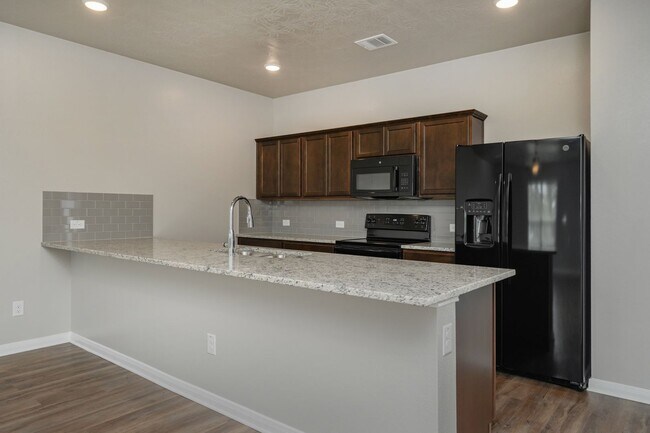 Building Photo - Live, love, and grow in this charming townhome!