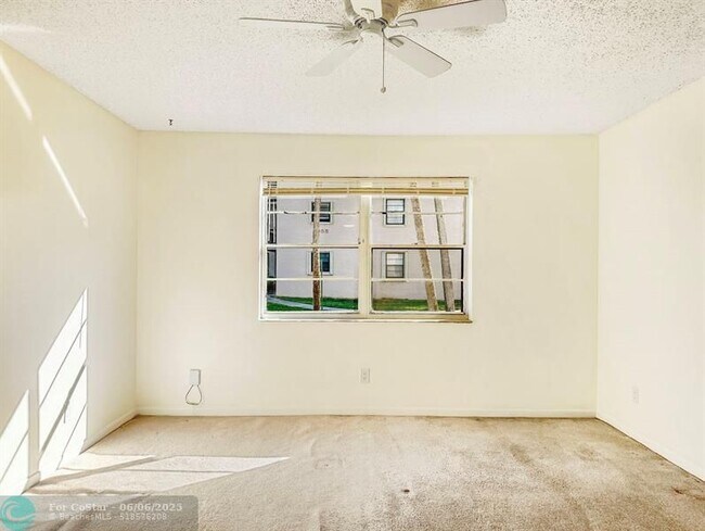 Building Photo - 6090 N Sabal Palm Blvd