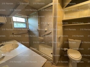 Building Photo - $1150- 4 bed 2 bath - Single Family Home