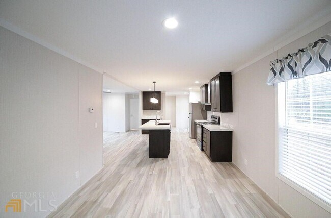 Building Photo - Spacious 4-Bedroom Home with Lawn Maintena...