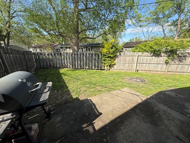 Building Photo - Brick Duplex with Fenced Yard on a Quiet S...