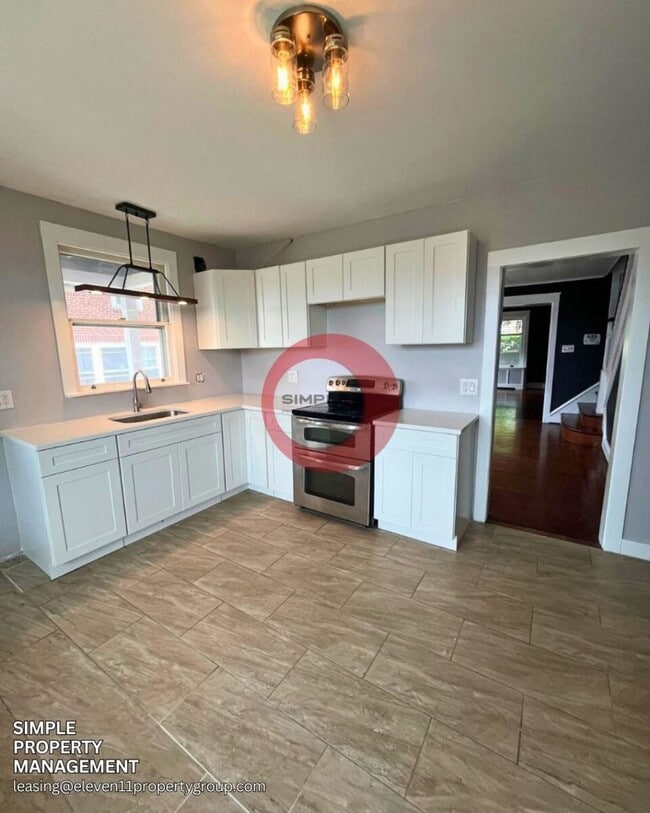 Building Photo - Four-bedroom 1.5 bath with Off street parking