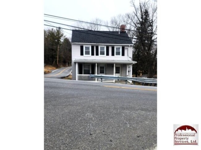 Building Photo - Cozy Country Living With Modern Updates