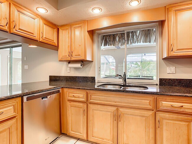 Building Photo - Port Charlotte Waterfront Pool Home - Grea...