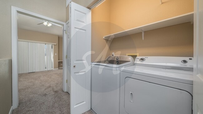 Building Photo - Spacious 3BR Townhome with 2-Car Garage & Private Covered Balcony