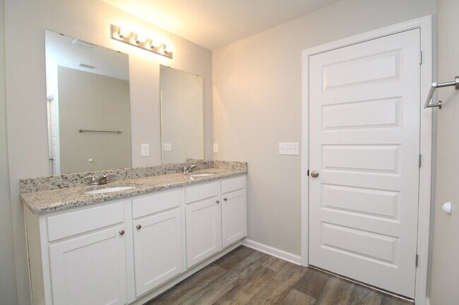 Building Photo - Coming Available Soon – 4BR/2BA Brick Home with Open Floor Plan, Solar Panels & 2-Car Garage in L...