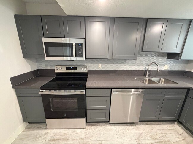 Building Photo - BEAUTIFULLY RENOVATED 3/2/2 CAR WITH DEN