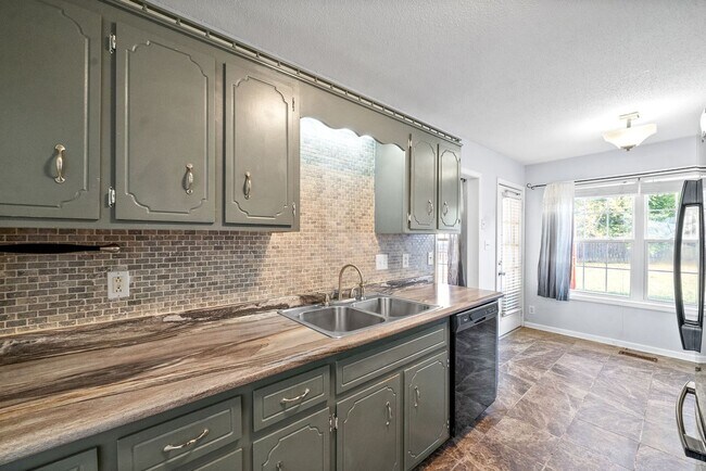 Building Photo - Adorable home with fenced back yard coming...