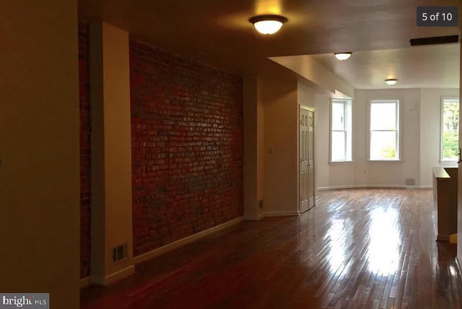 Dining/Living Room with exposed brick - 2220 Madison Ave