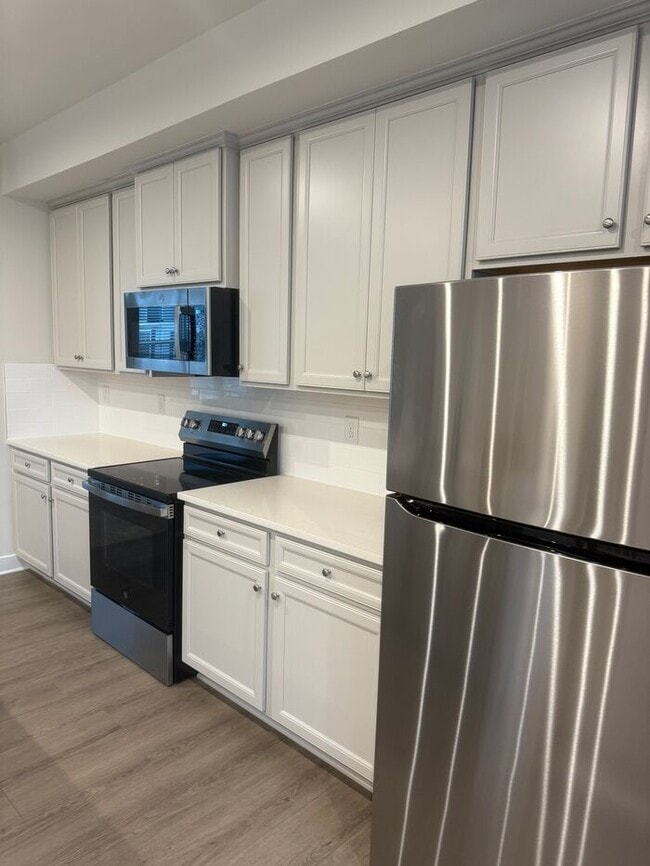 Building Photo - Brand New 3-Story Townhome with 2-Car Gara...