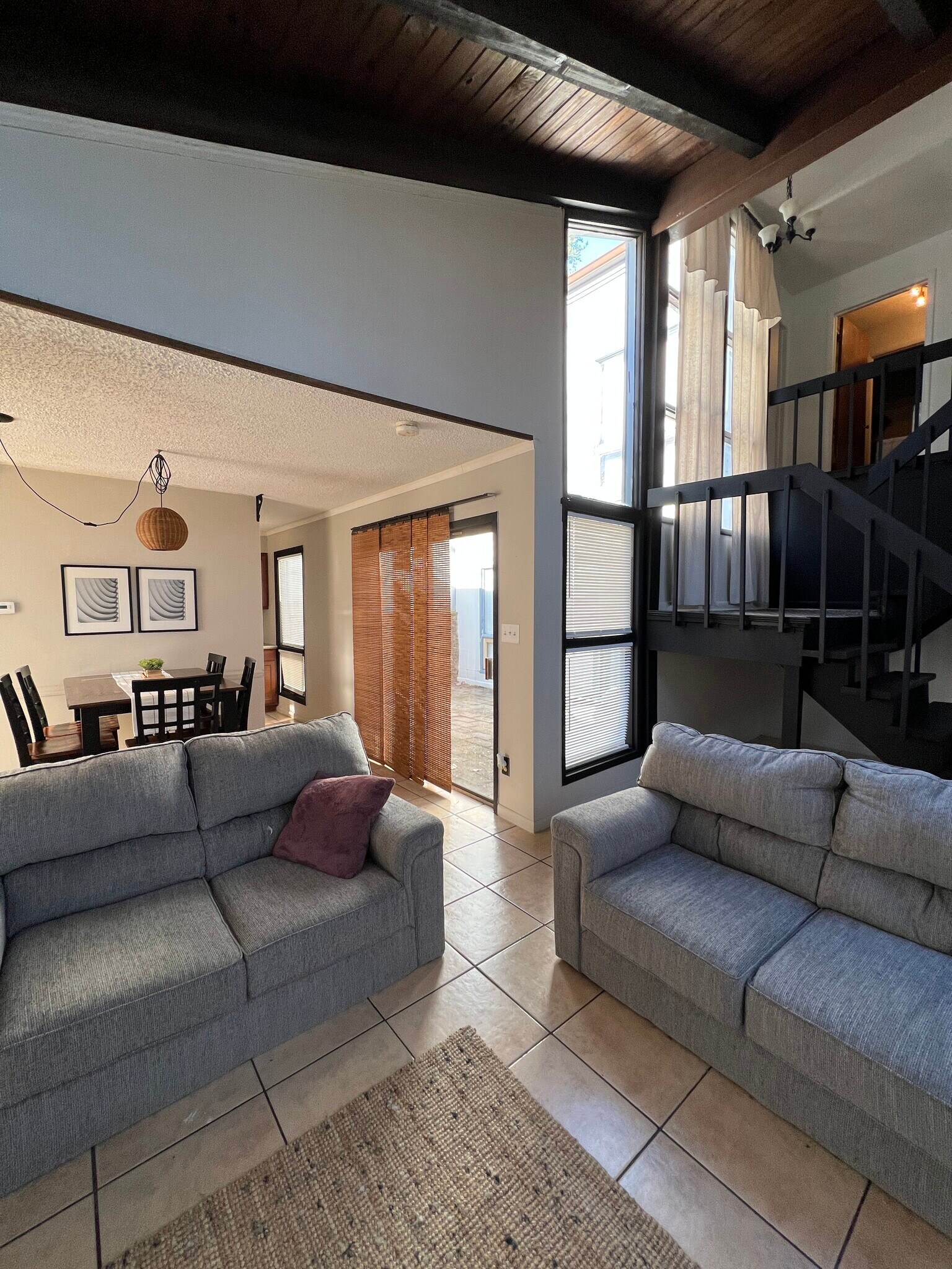 Living room, dining room, indoor courtyard and stairs view - 3645 Belmont Rd